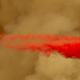 A photo of a Boeing 737 dropping fire retardant on a forrest fire.